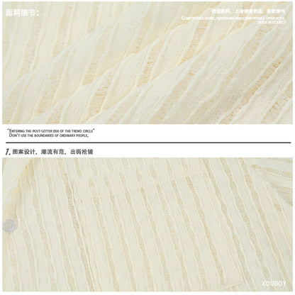 A loose and casual short-sleeved shirt with a design sense of wheat ear and milk apricot color, featuring a hollowed-out design
